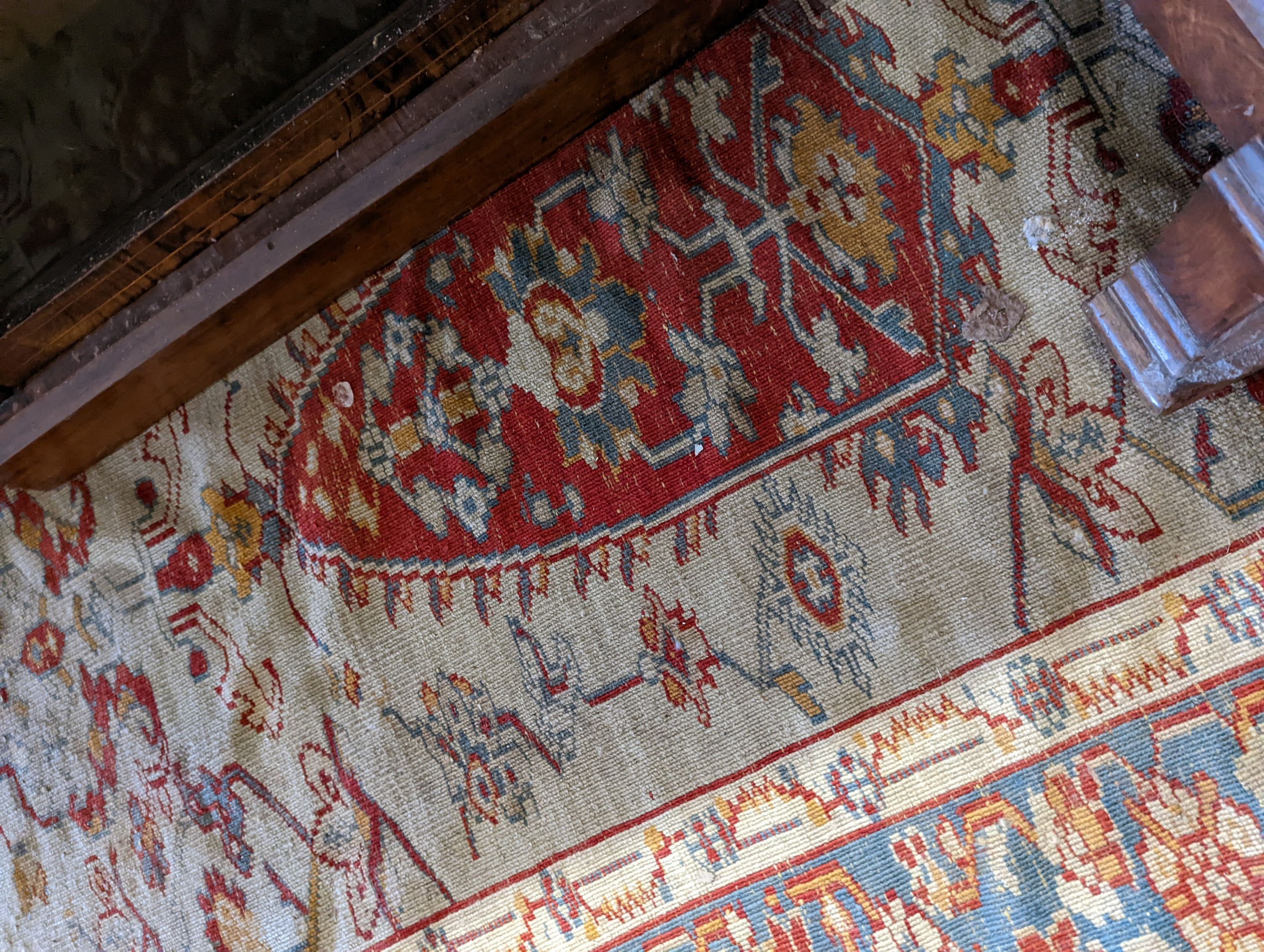 An antique Turkish? ivory ground rug, 218 cm long, 145 cm wide